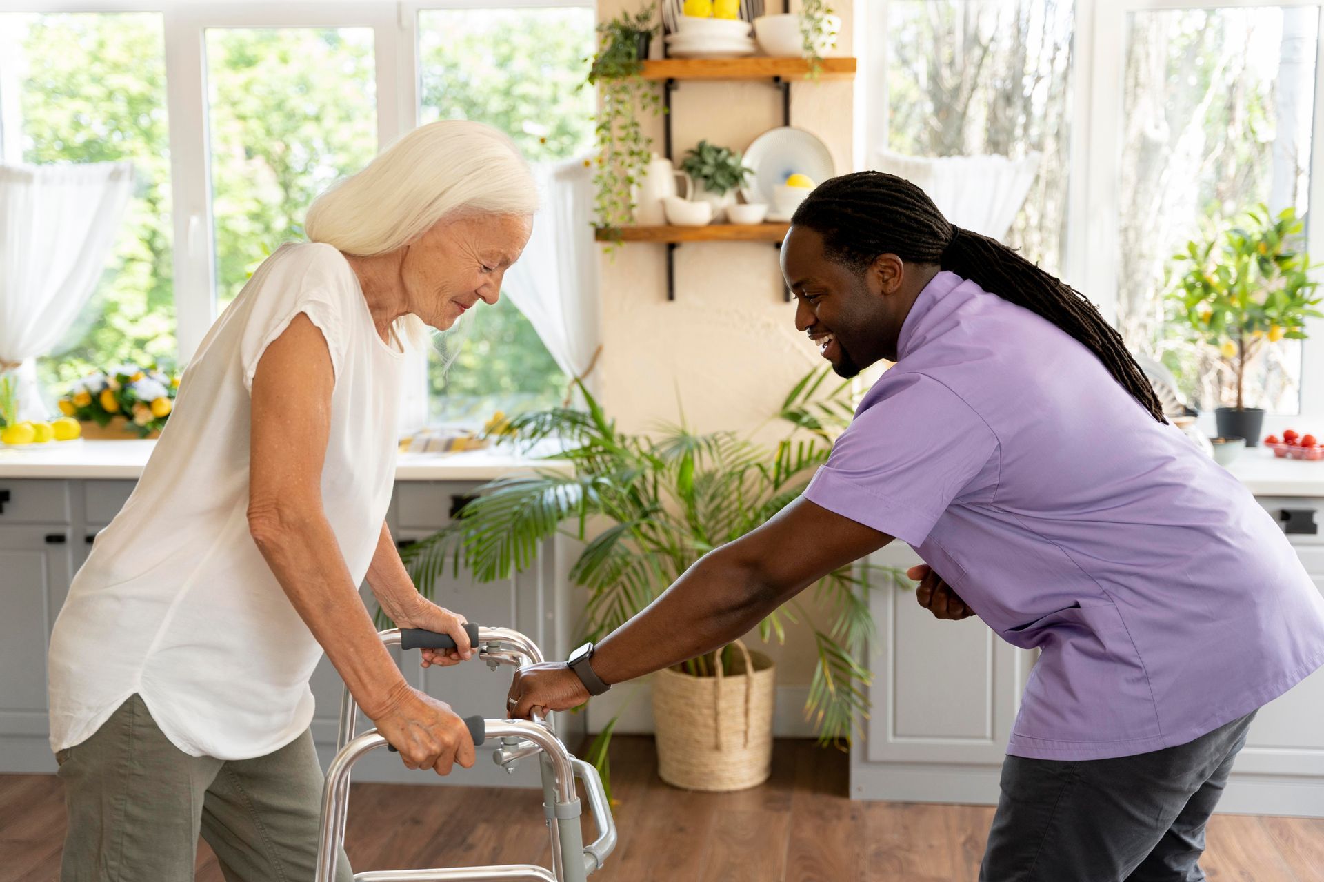 NDIS support coordinator helping a participant with a walker at home