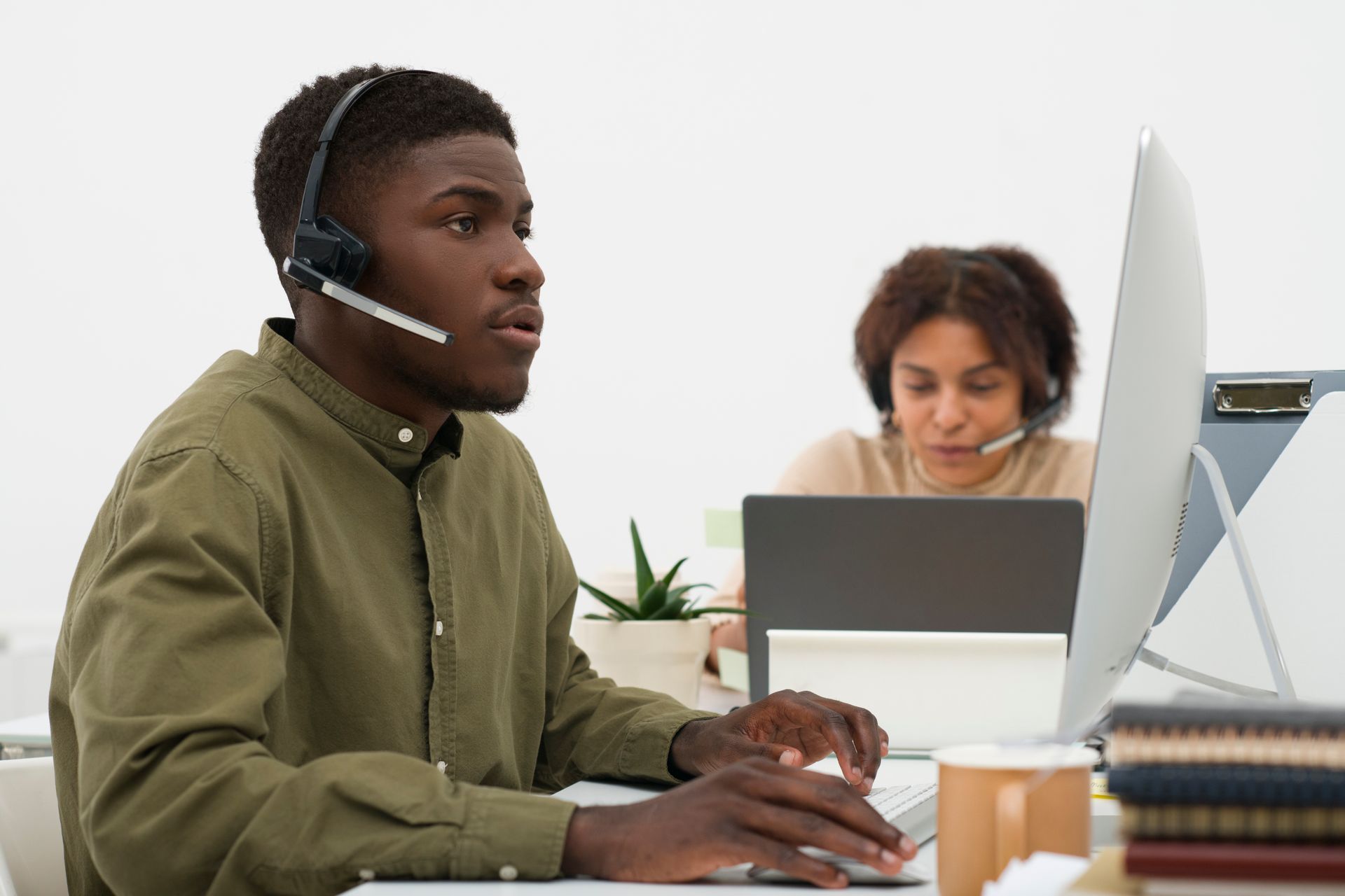 Disability support coordinator providing assistance at a call centre