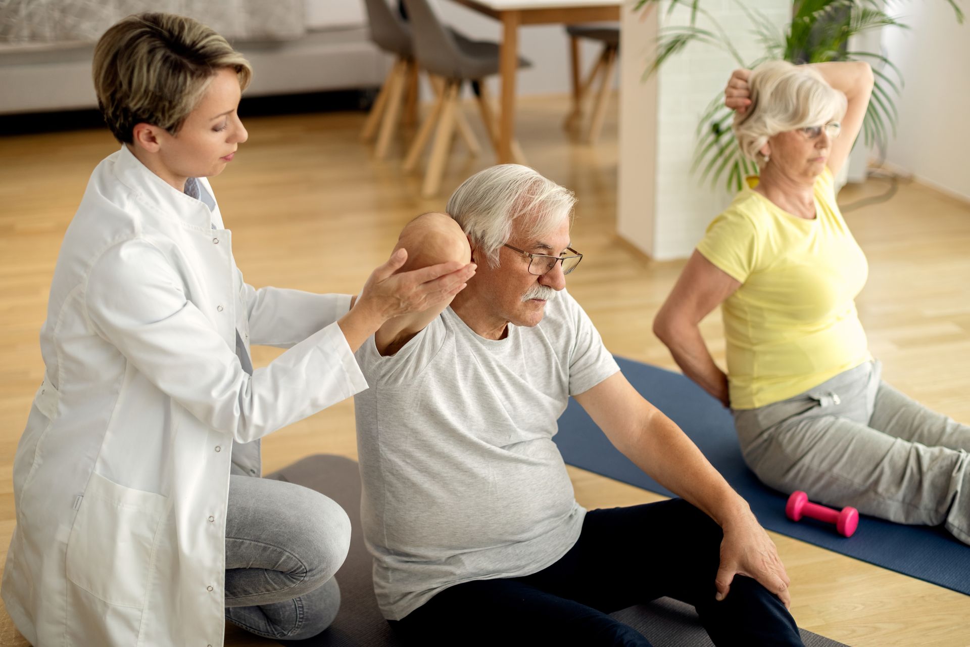 Physiotherapist supporting senior flexibility exercises, aligning with growing physiotherapy demand in Australia’s ageing population