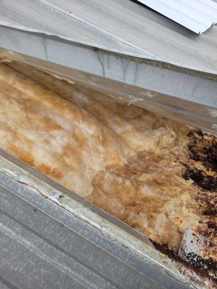 A close up of a piece of insulation on a roof.