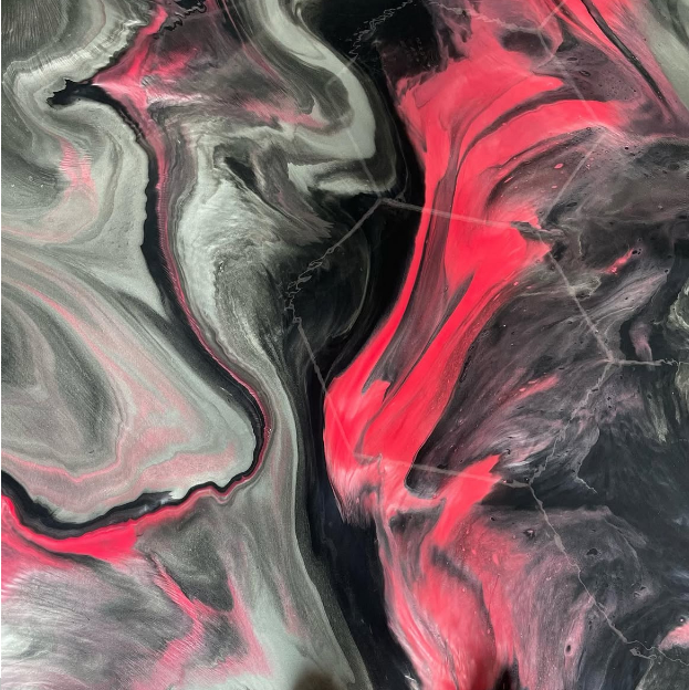 Abstract flooring design with swirls of black, gray, and bright pink.