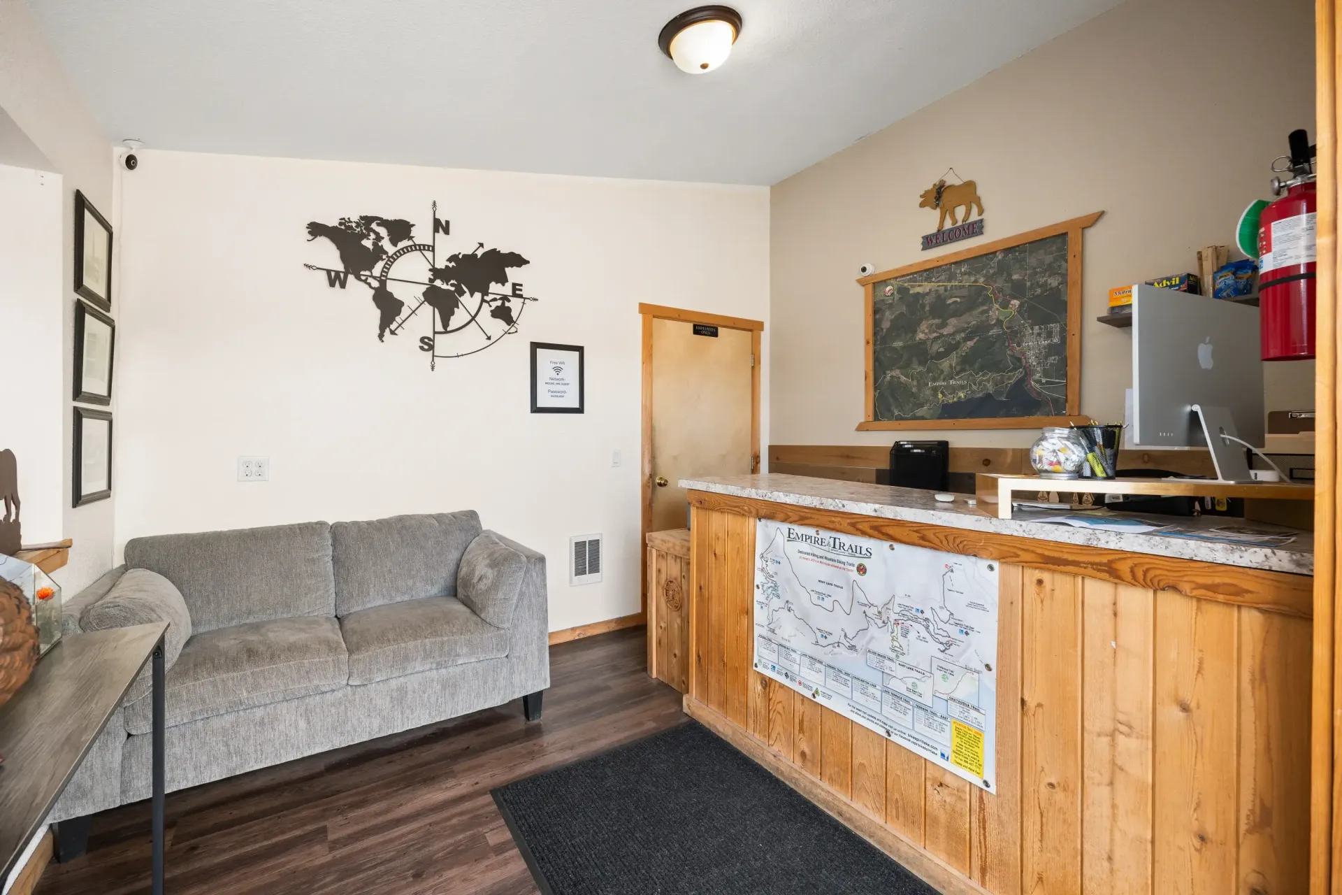 A living room with a couch and a wooden counter.