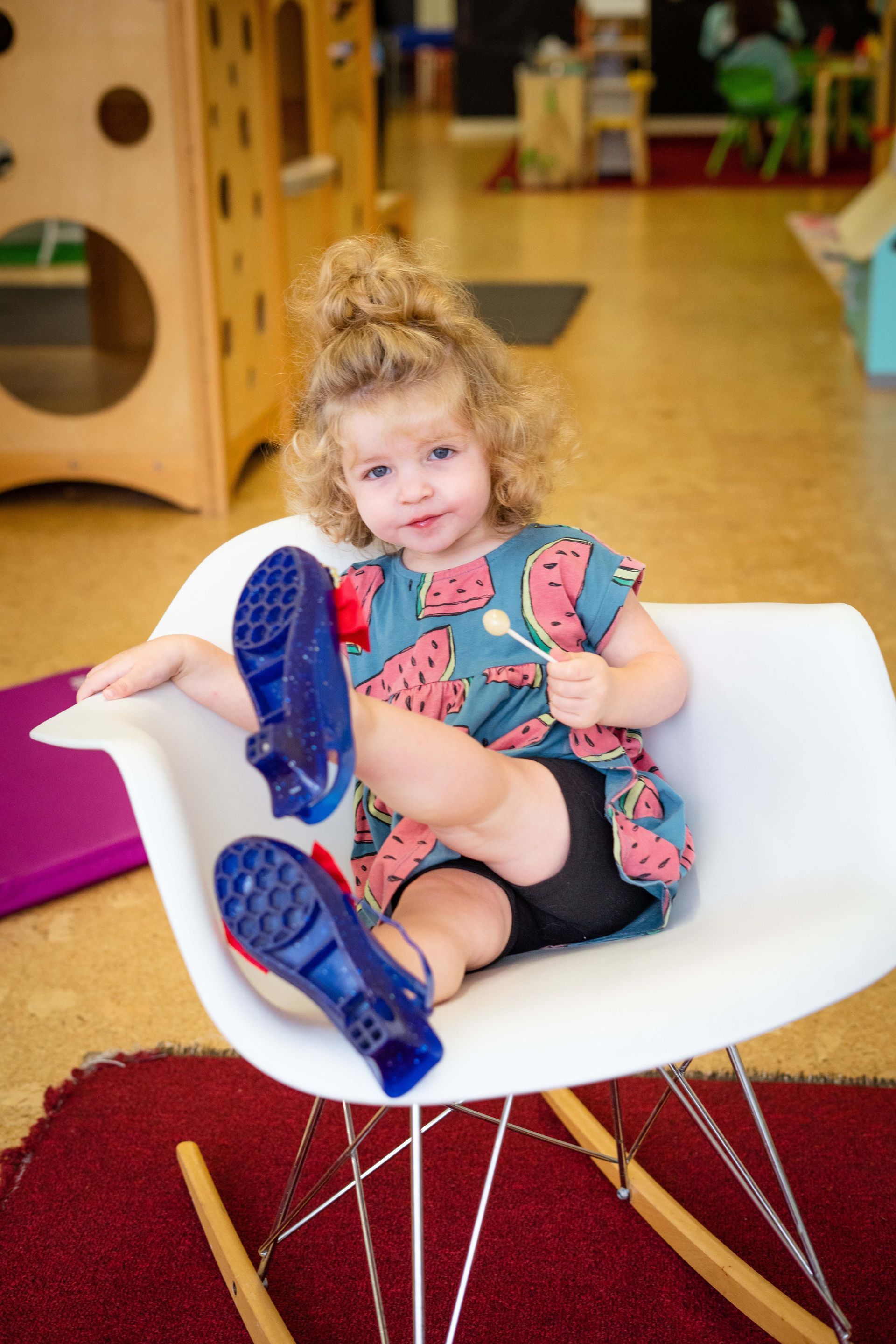 Girl toddler sitting on the chair