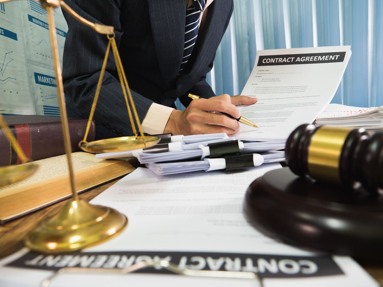 The inside of a moving truck filled with boxes and blankets.