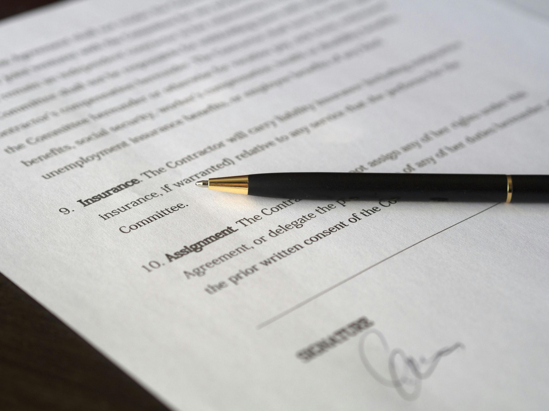 Pen on a contract, highlighting 