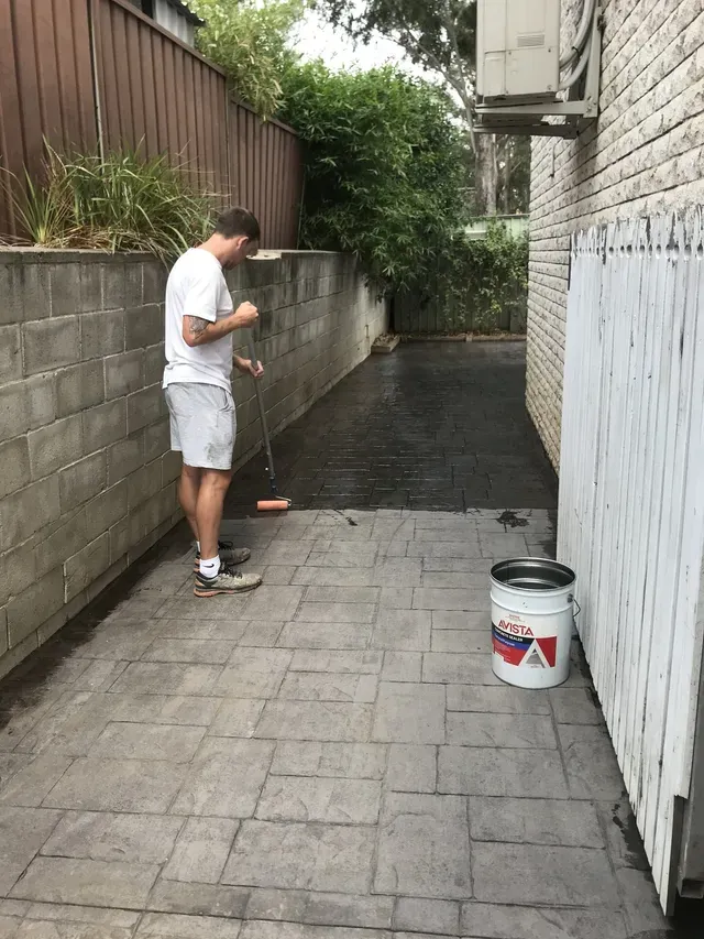 Man Painting The Floor Using Roller — Penrith, NSW — Bright Spots Painting & Decorating