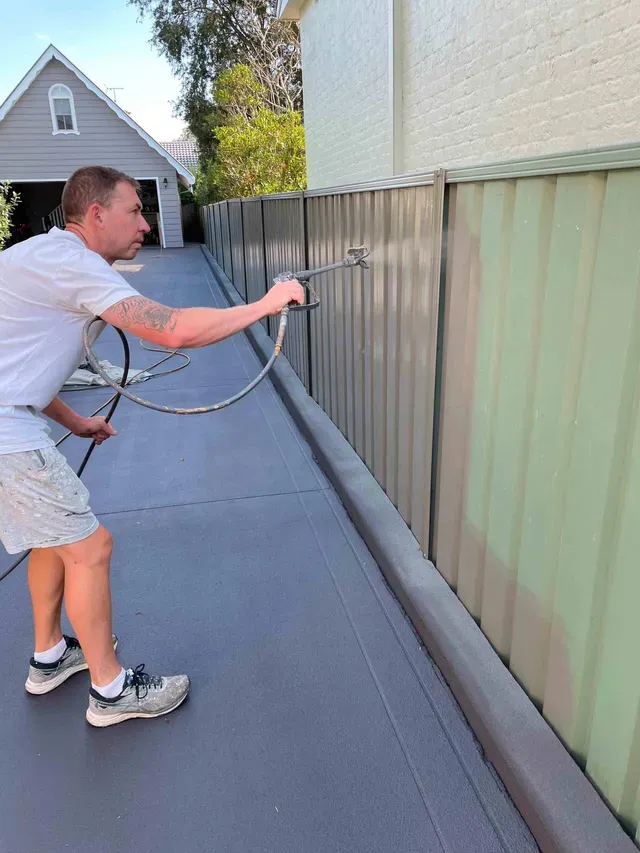 Man Painting Using Spray Gun — Penrith, NSW — Bright Spots Painting & Decorating
