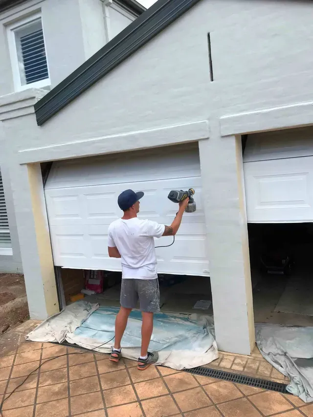 Man Painting The Garage — Penrith, NSW — Bright Spots Painting & Decorating