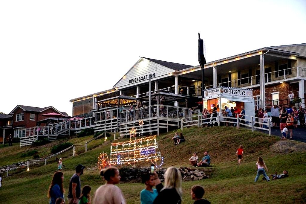 A group of people are standing in front of a large building.