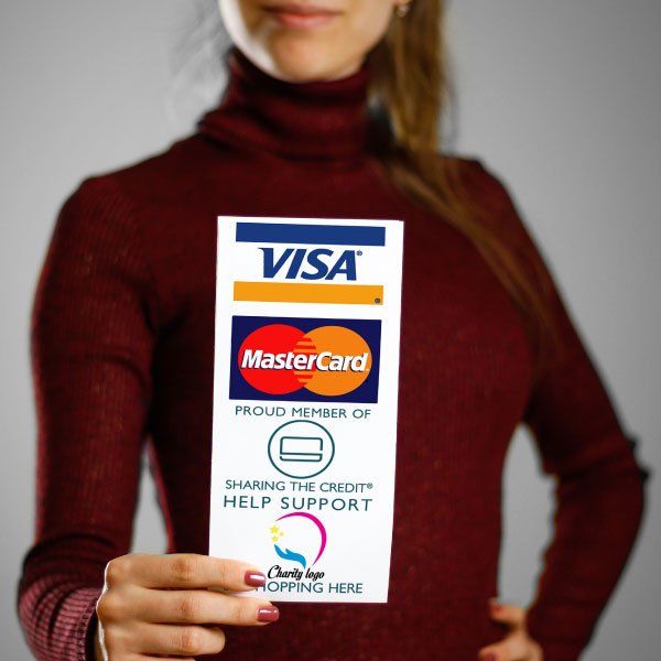 A woman is holding a card that says visa and mastercard