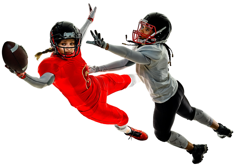 Two female football players in action, one catching the ball, the other reaching.