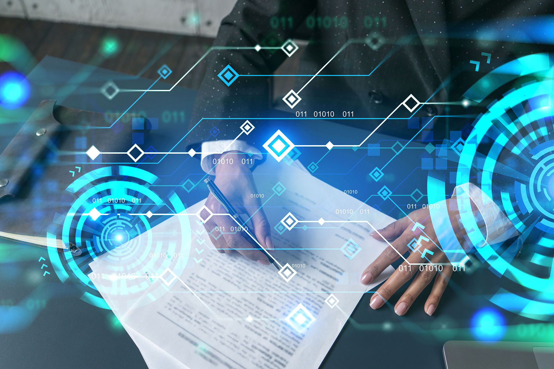 Person in business attire signing document, overlaid with digital data visualization.