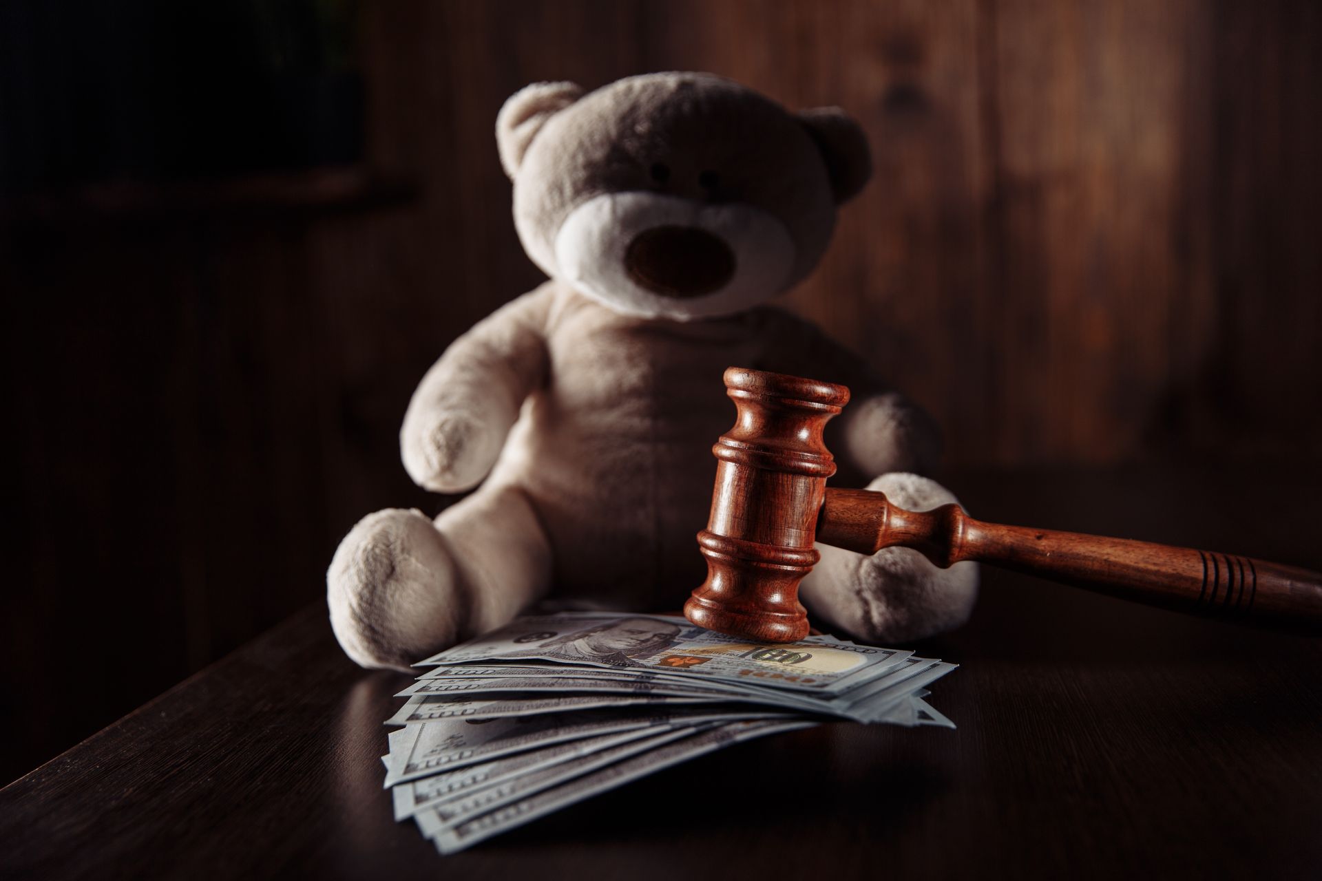 Girl with eyes closed, embracing someone. They are indoors.