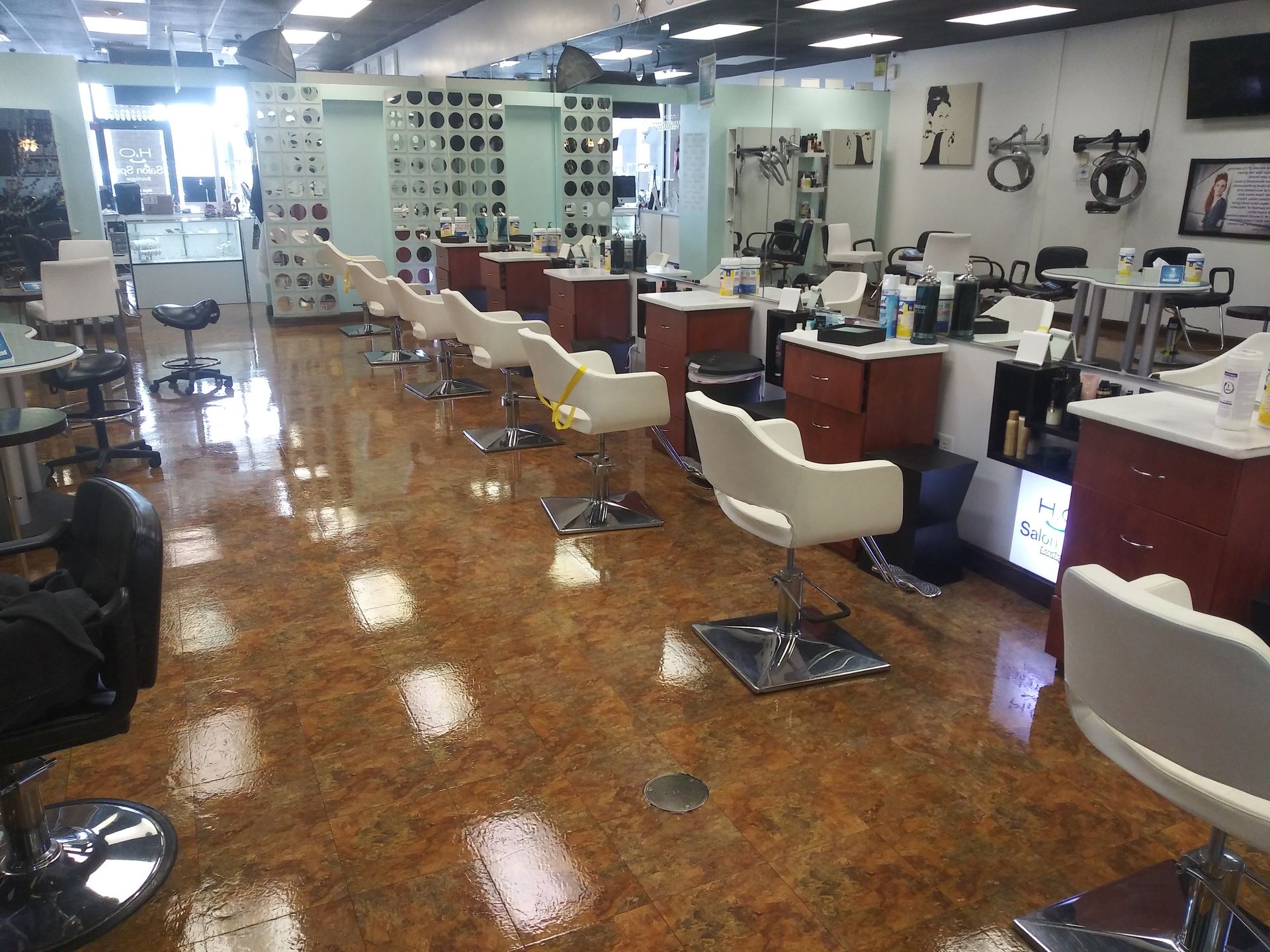 A salon with a lot of chairs and tables