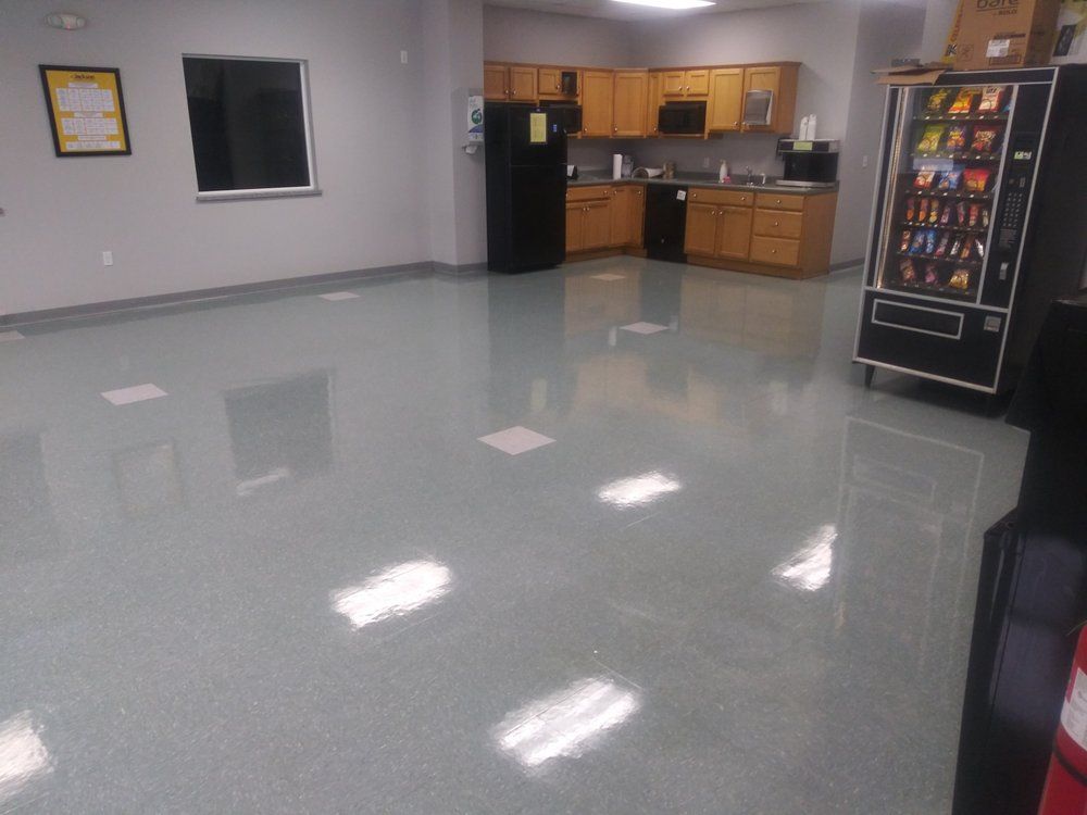 A kitchen with a vending machine and a refrigerator