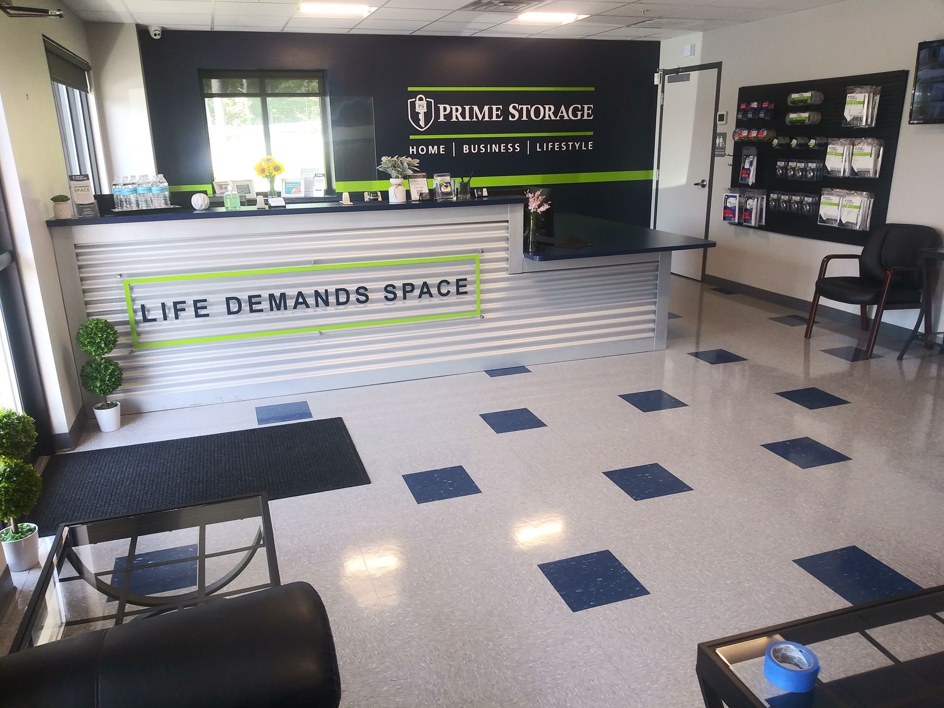A reception area with a sign that says life demands space