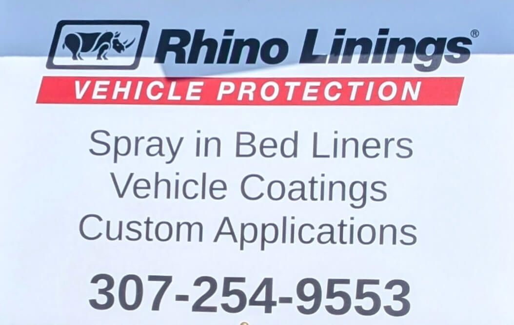 Rhino Linings sign with logo, text 