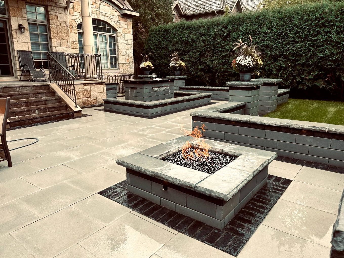 There is a fire pit in the middle of the patio.