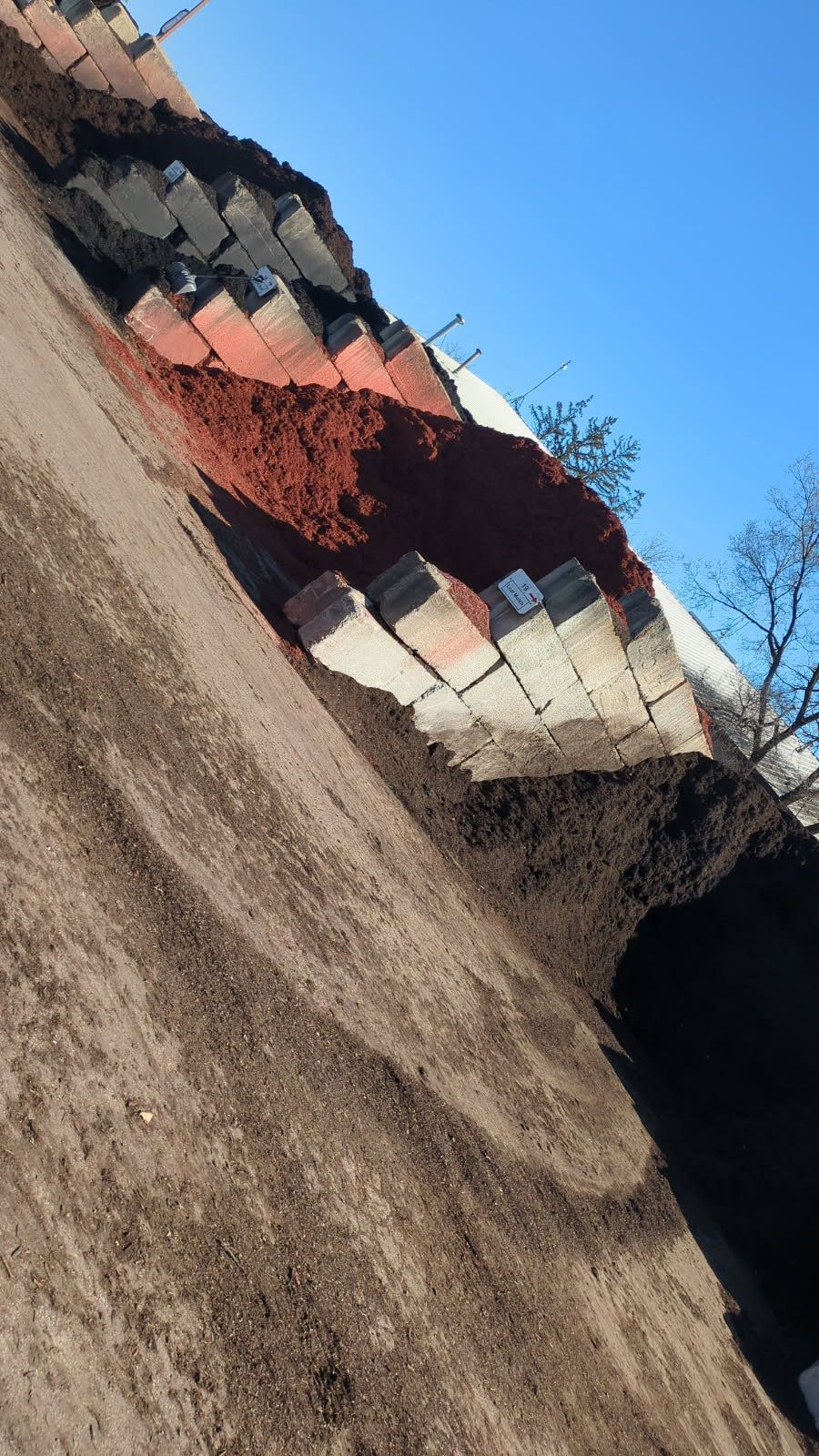 A pile of dirt is sitting on top of a hill.