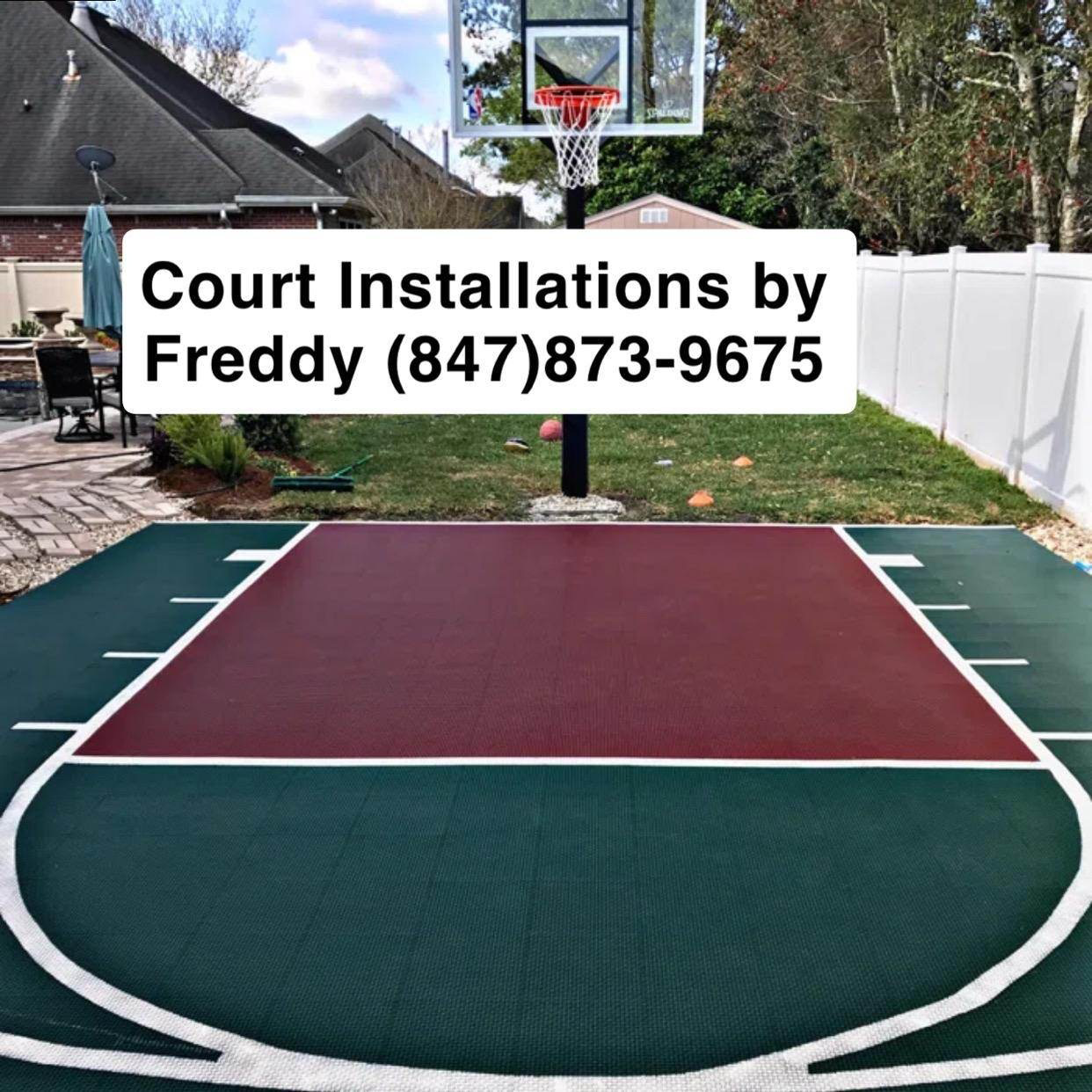 A basketball court with a sign that says court installations by freddy