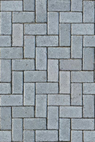 Gray rectangular pavers arranged in a staggered, brickwork pattern.