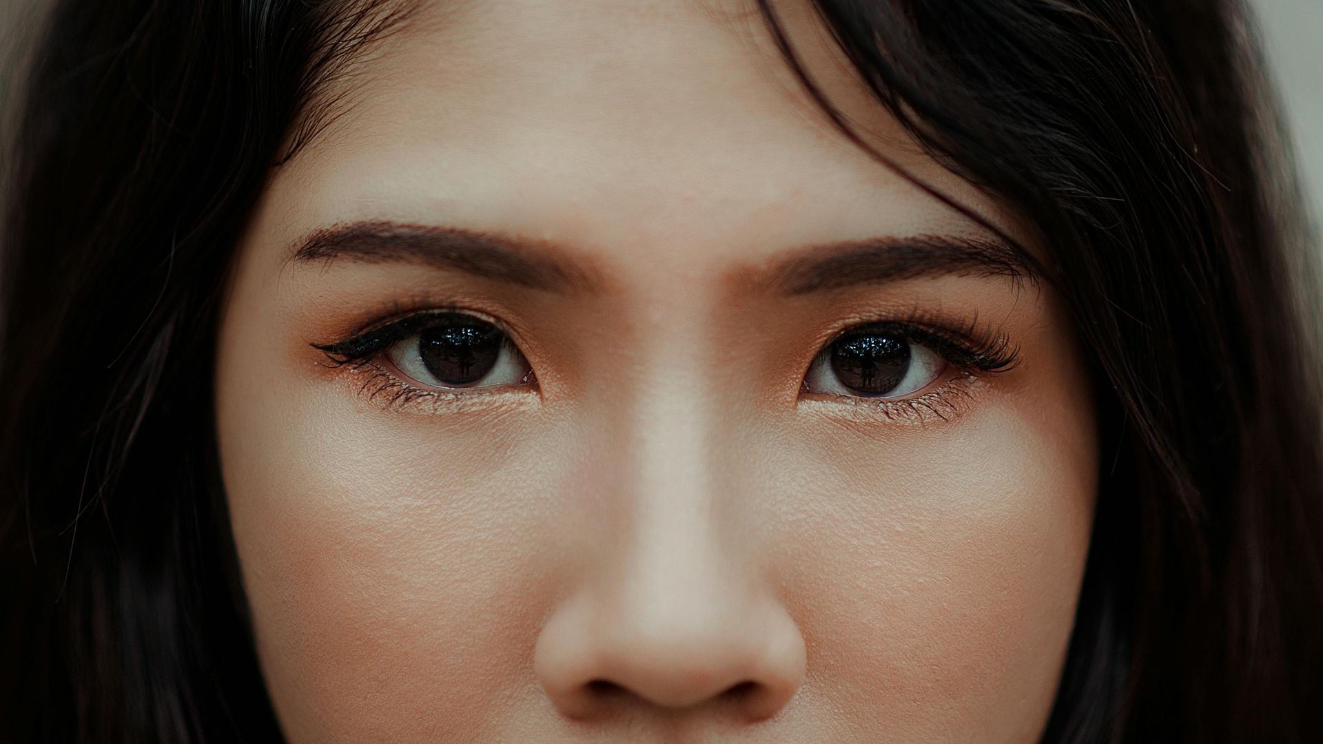 A close up of a woman 's eyes and nose.