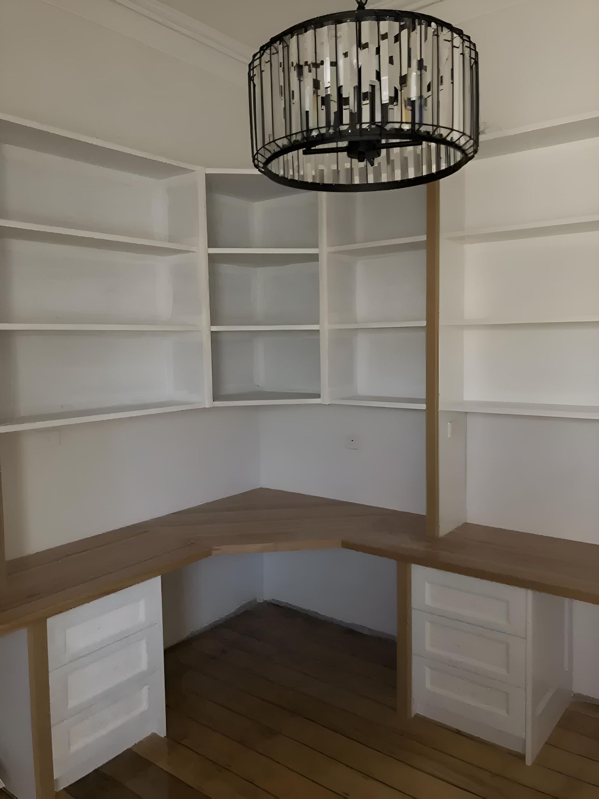 A room with a desk and shelves and a chandelier hanging from the ceiling — Hey Presto Kitchens & Renovations in Armidale, NSW