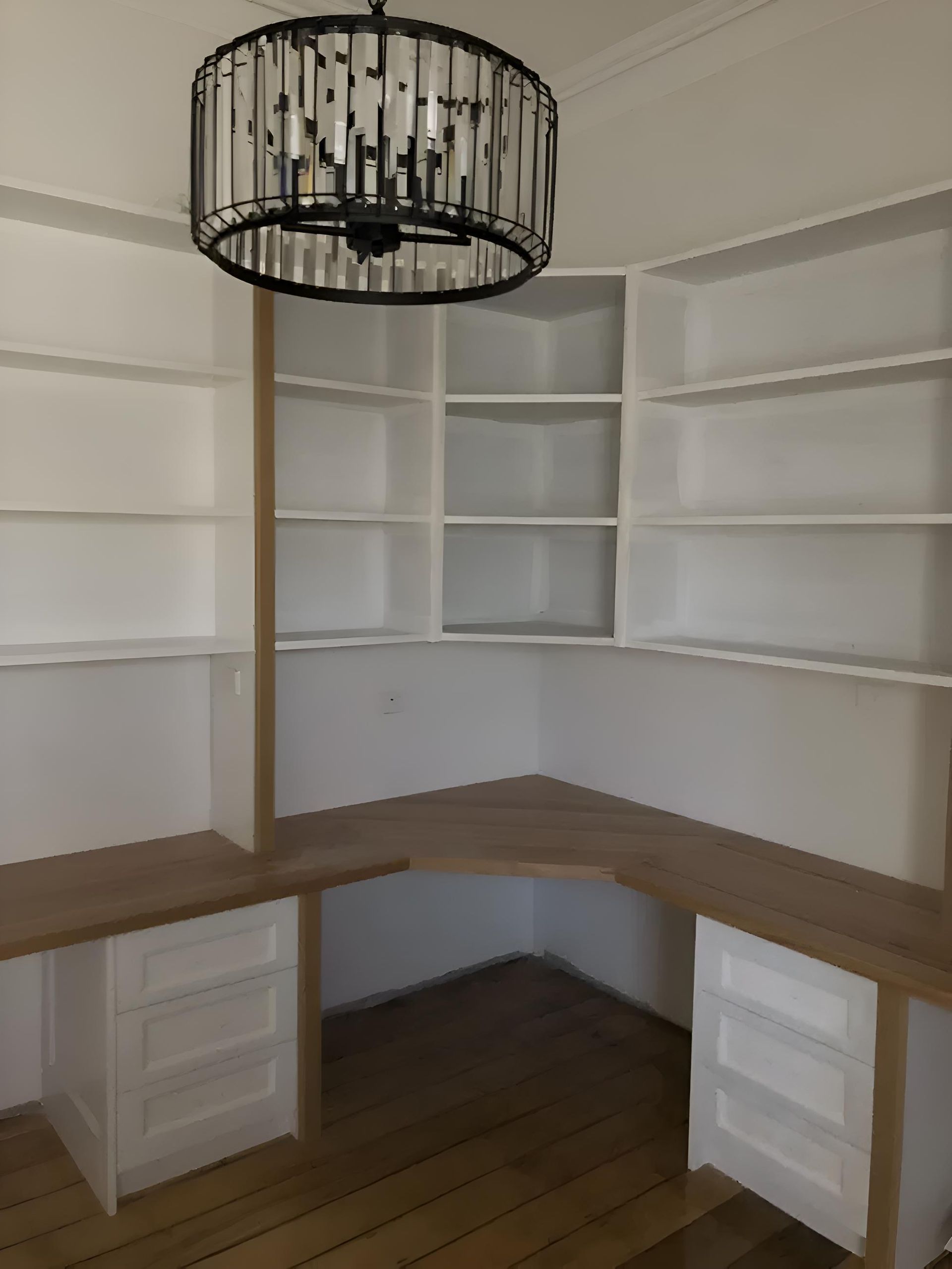 A Room With A Desk And Shelves And A Chandelier Hanging From The Ceiling — Hey Presto Kitchens & Renovations in Armidale, NSW