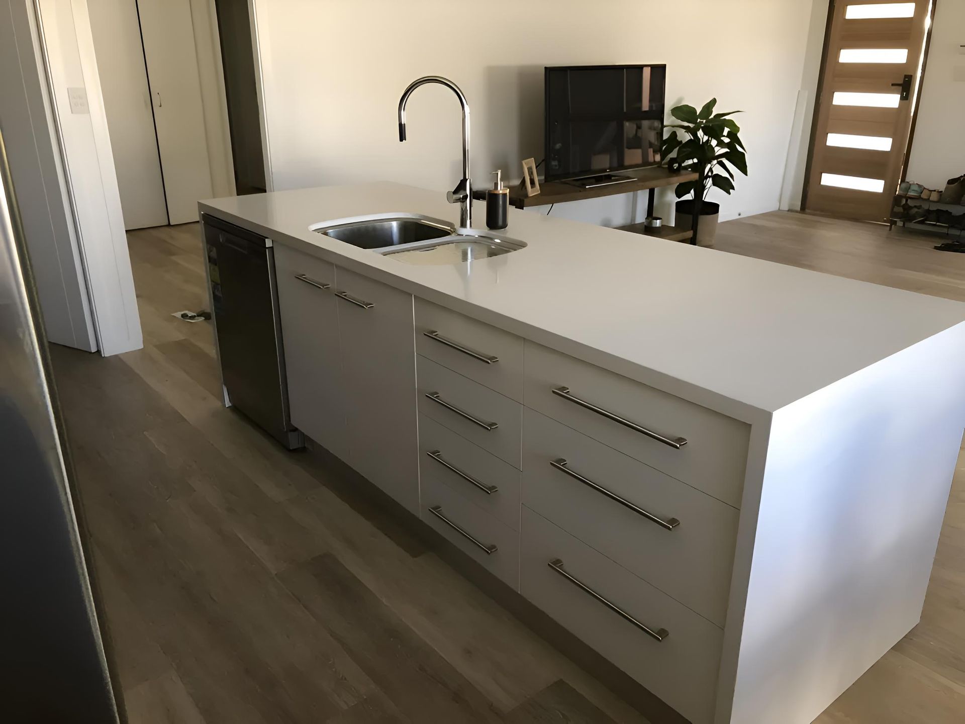 A Kitchen With A Large Island And A Sink — Hey Presto Kitchens & Renovations in Armidale, NSW