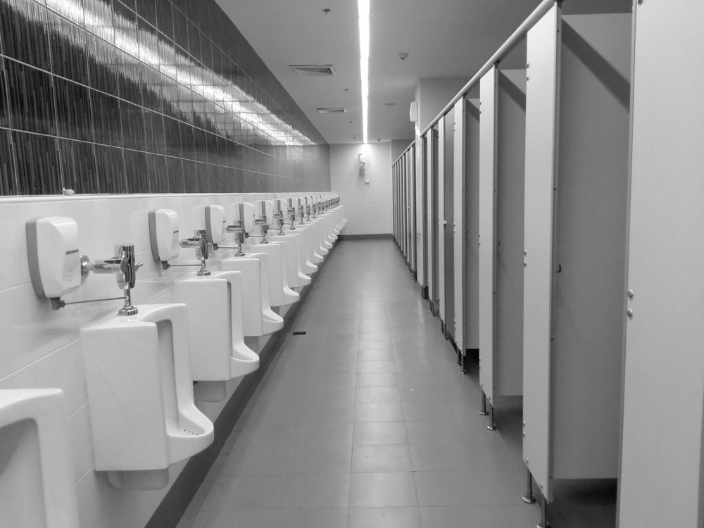 A Long Row of Urinals in a Public Restroom — Hey Presto Kitchens & Renovations in Armidale, NSW