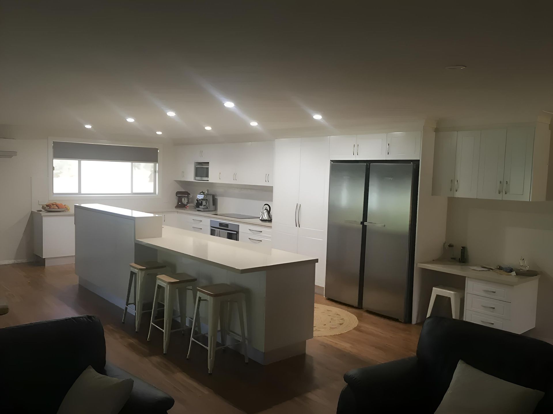 A Kitchen With White Cabinets And Stainless Steel Appliances — Hey Presto Kitchens & Renovations in Armidale, NSW