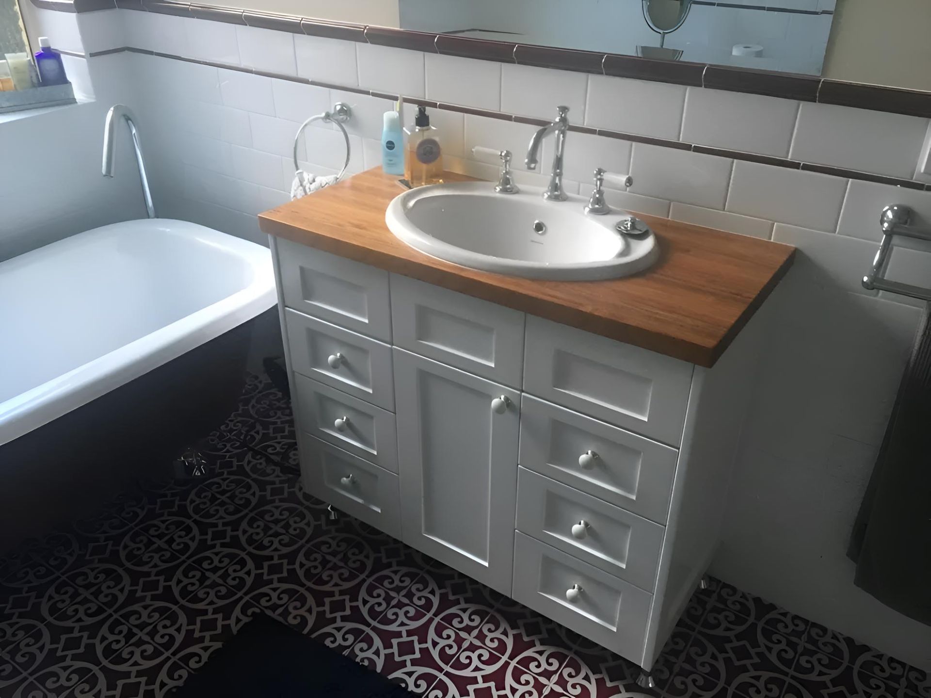 A Bathroom With A Sink , Bathtub And Mirror — Hey Presto Kitchens & Renovations in Armidale, NSW