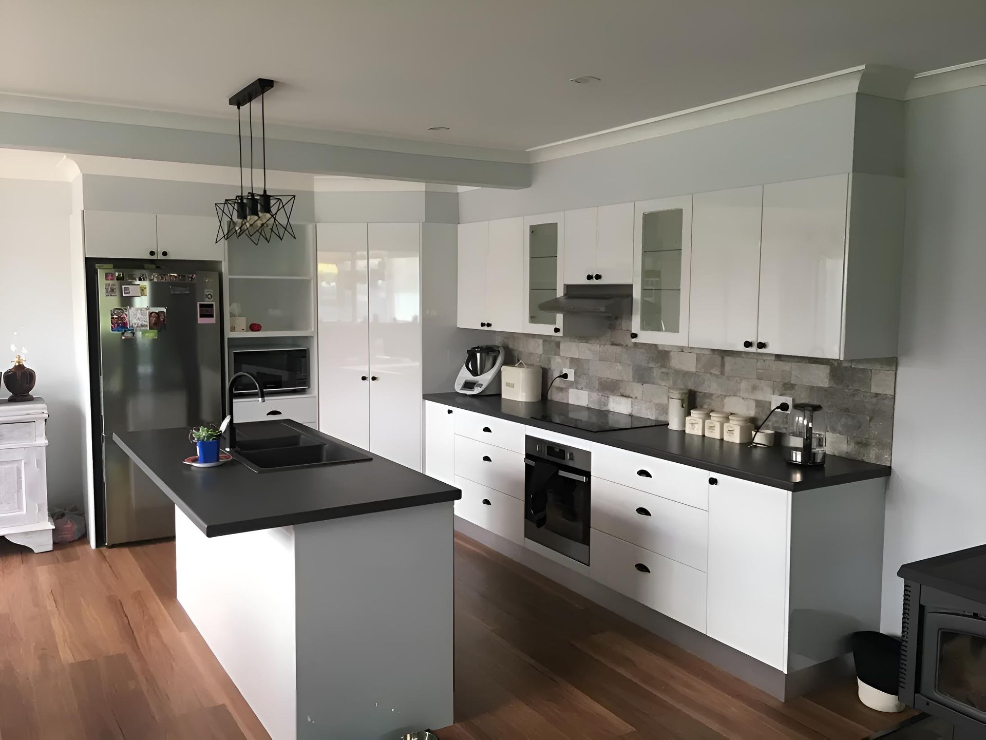 A Kitchen With White Cabinets , Stainless Steel Appliances — Hey Presto Kitchens & Renovations in Armidale, NSW