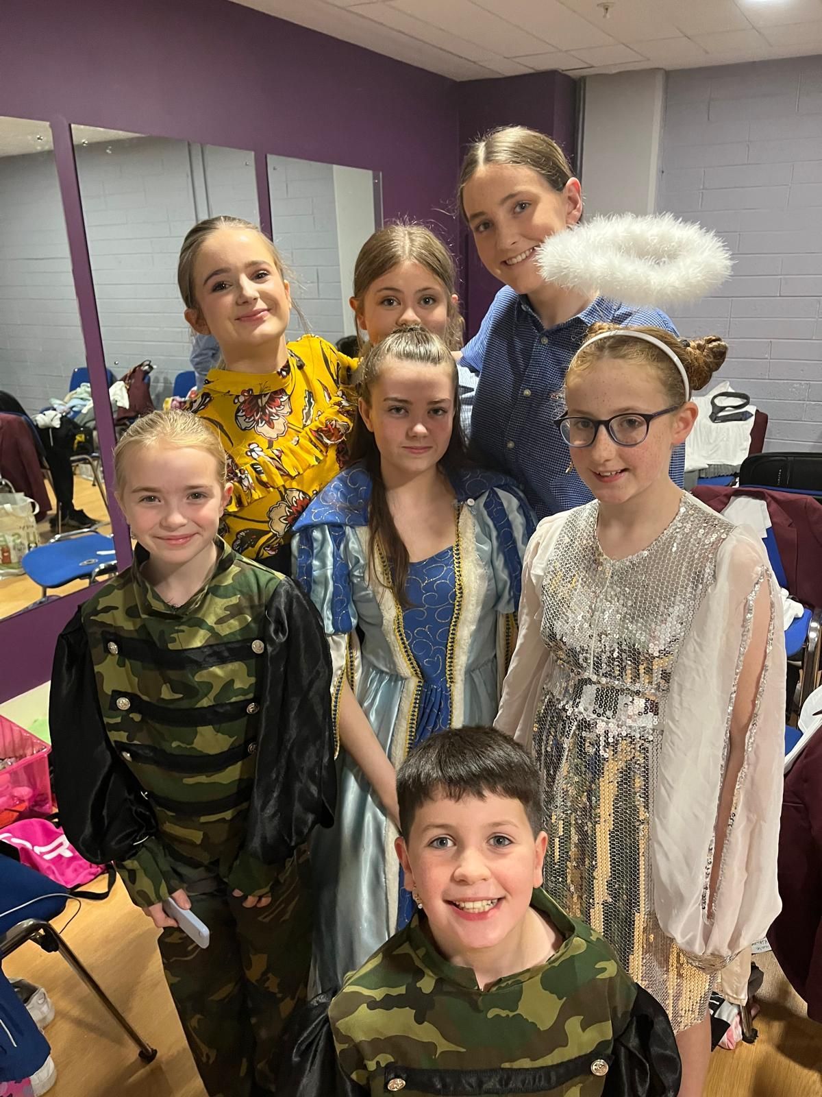 A man is giving a presentation to a group of people in a room.