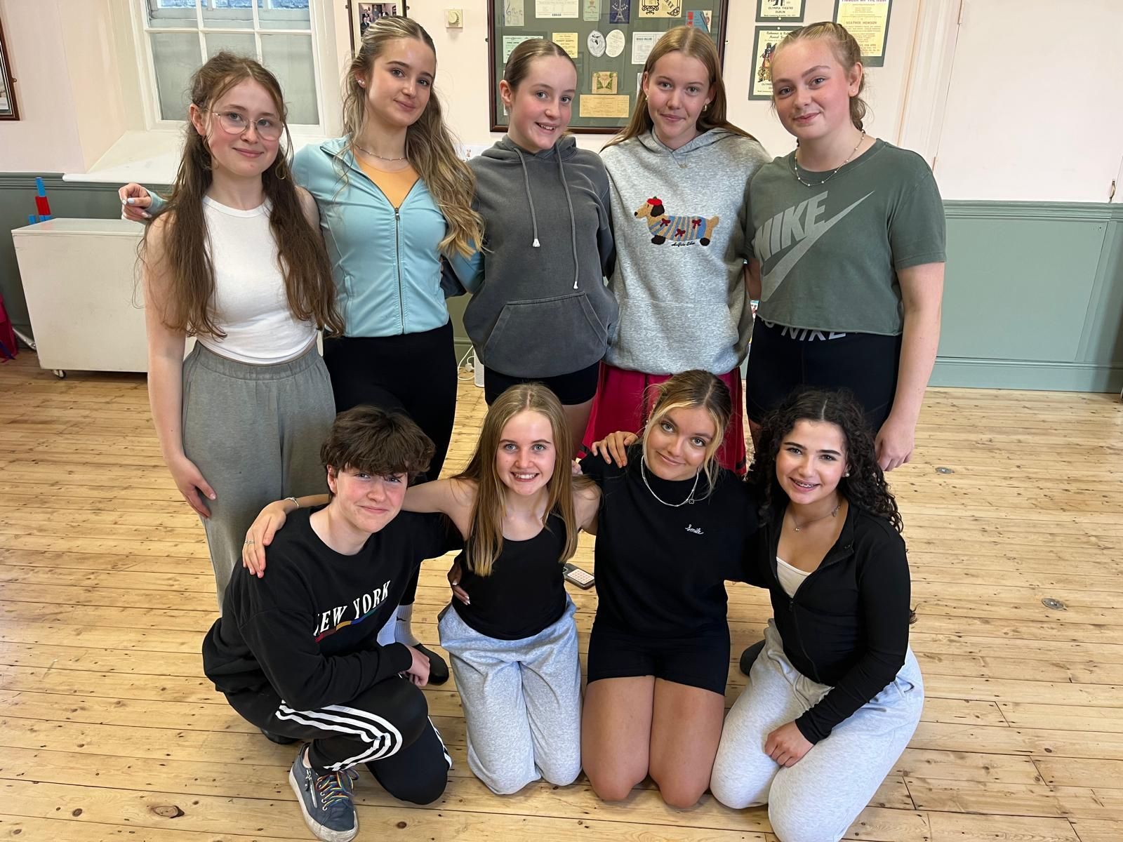 A group of people are dancing on a stage.