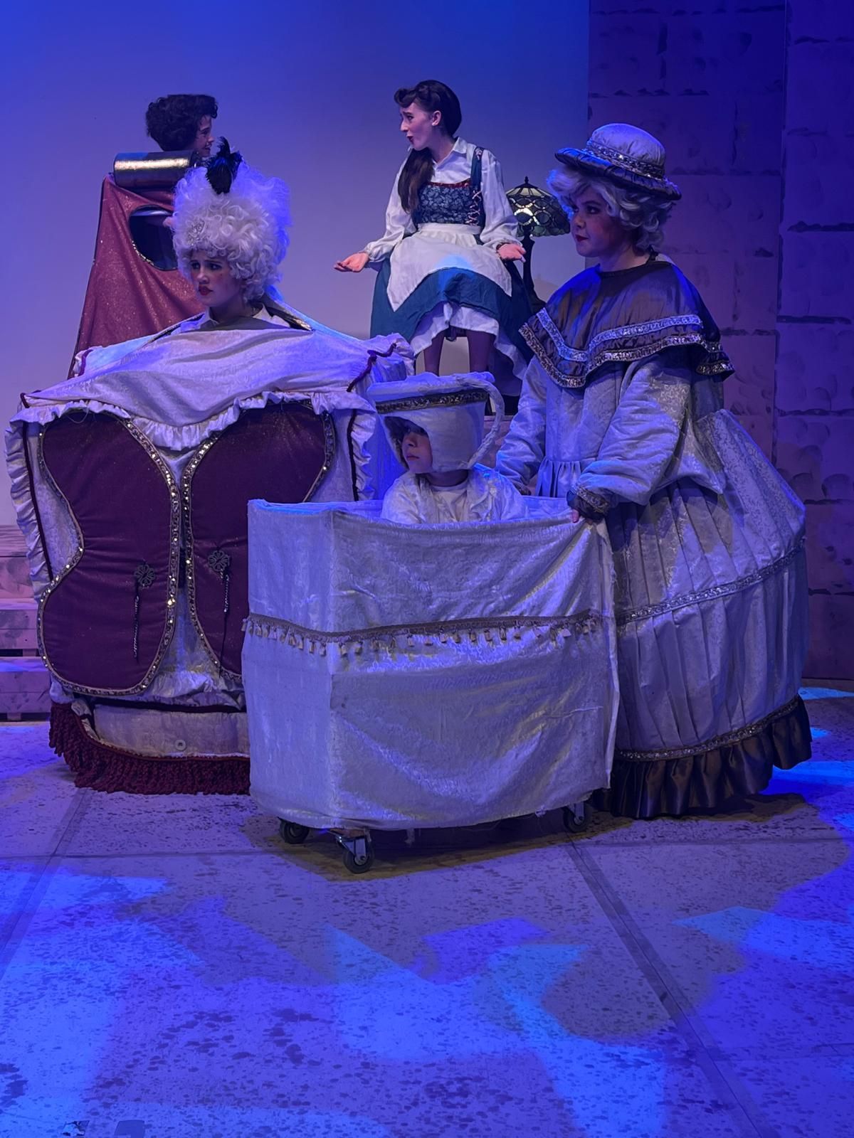 A large group of people are posing for a picture on a stage.