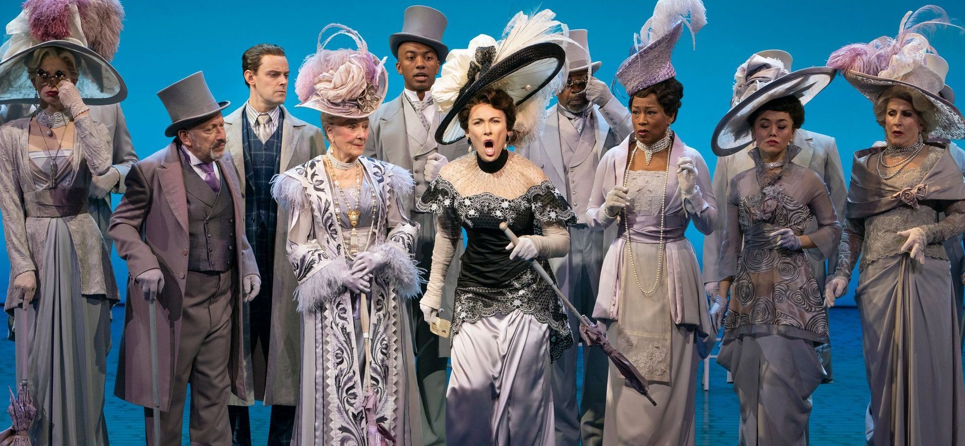 A group of people are standing next to each other on a stage.