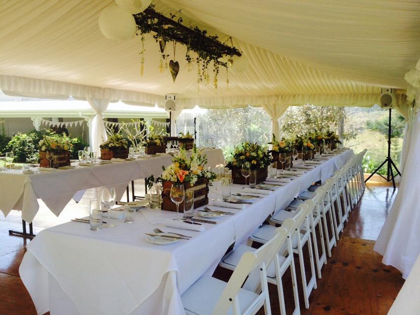 Wedding Table With Flowers In A Wooden Pot — Wedding & Event Hire In Goonellabah, NSW