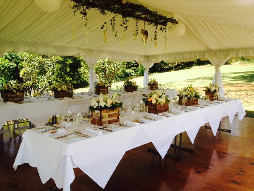 Wedding Table With Flowers In A Wooden Pot — Wedding & Event Hire In Goonellabah, NSW