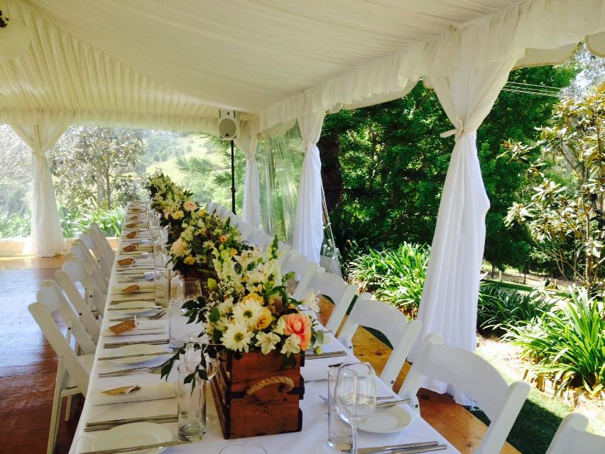 Wedding Table With Flowers At The Center — Wedding & Event Hire In Goonellabah, NSW