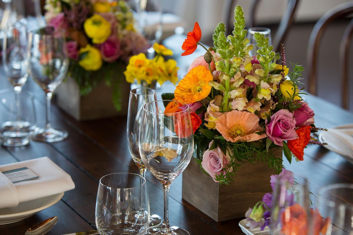 Flowers And Wine Glass On A Wooden Table — Wedding & Event Hire In Goonellabah, NSW