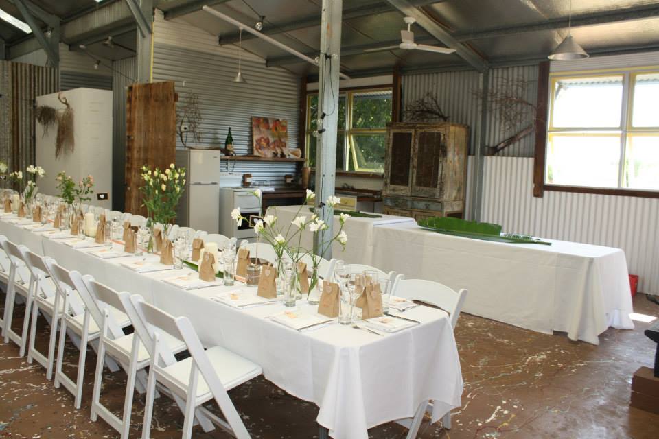 White Table With Flowers On The Center — Wedding & Event Hire In Goonellabah, NSW