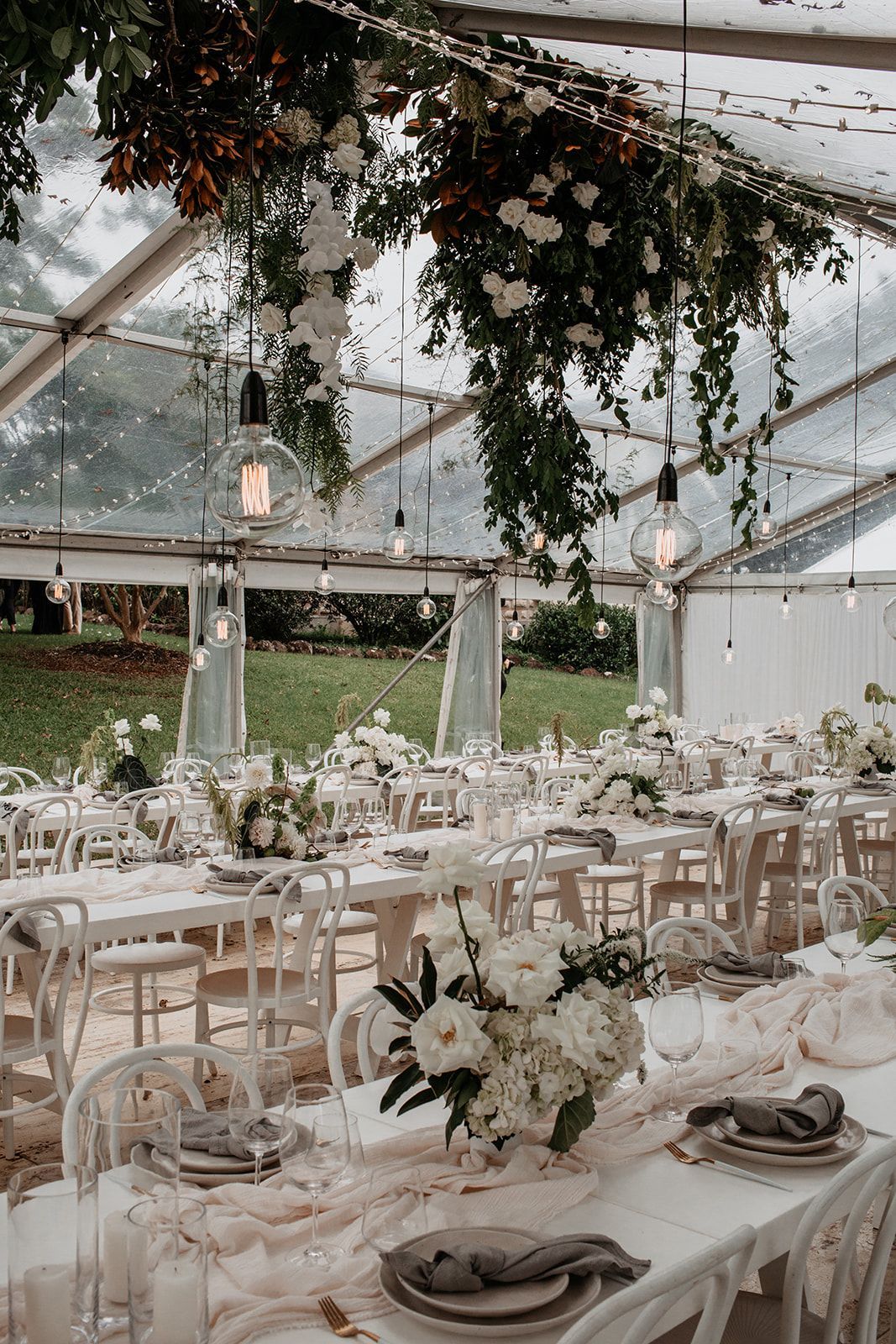 A Clear Tent With Tables And Chairs Set Up For A Wedding Reception — Wedding & Event Hire In Byron Bay, NSW