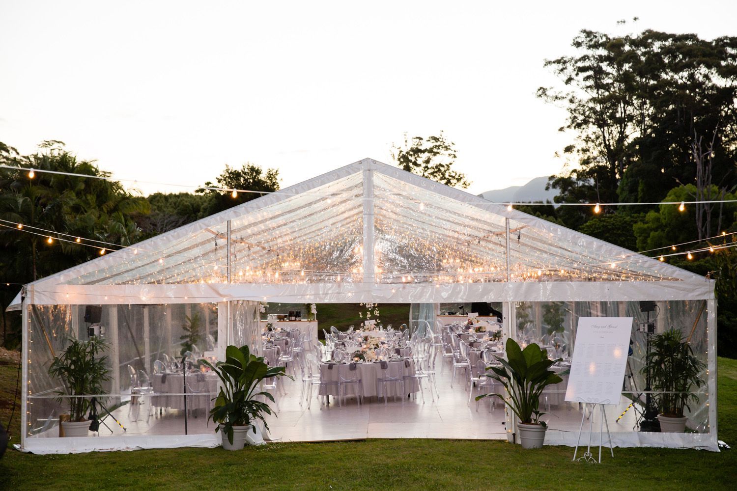 A Large Clear Tent With Tables And Chairs Inside Of It — Wedding & Event Hire In Mullumbimby, NSW