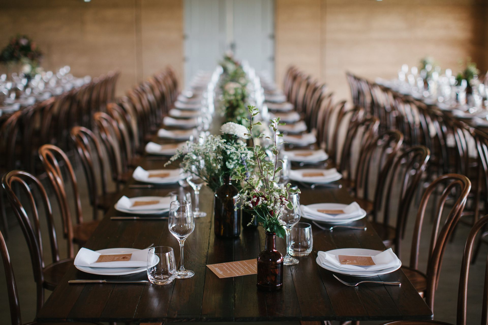 A Long Table With Plates, Glasses, And Flowers On It Is Set For A Wedding Reception — Wedding & Event Hire In Goonellabah, NSW