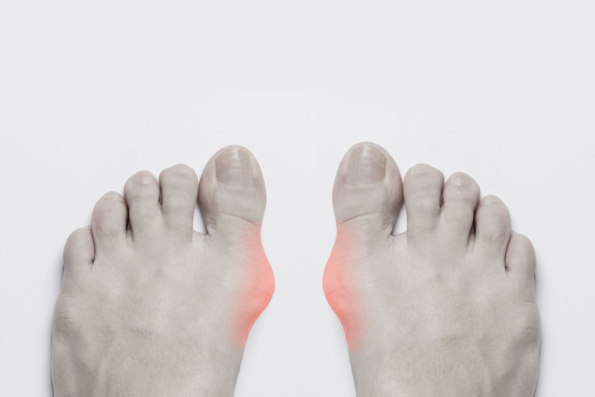 A pair of feet with red spots on them.