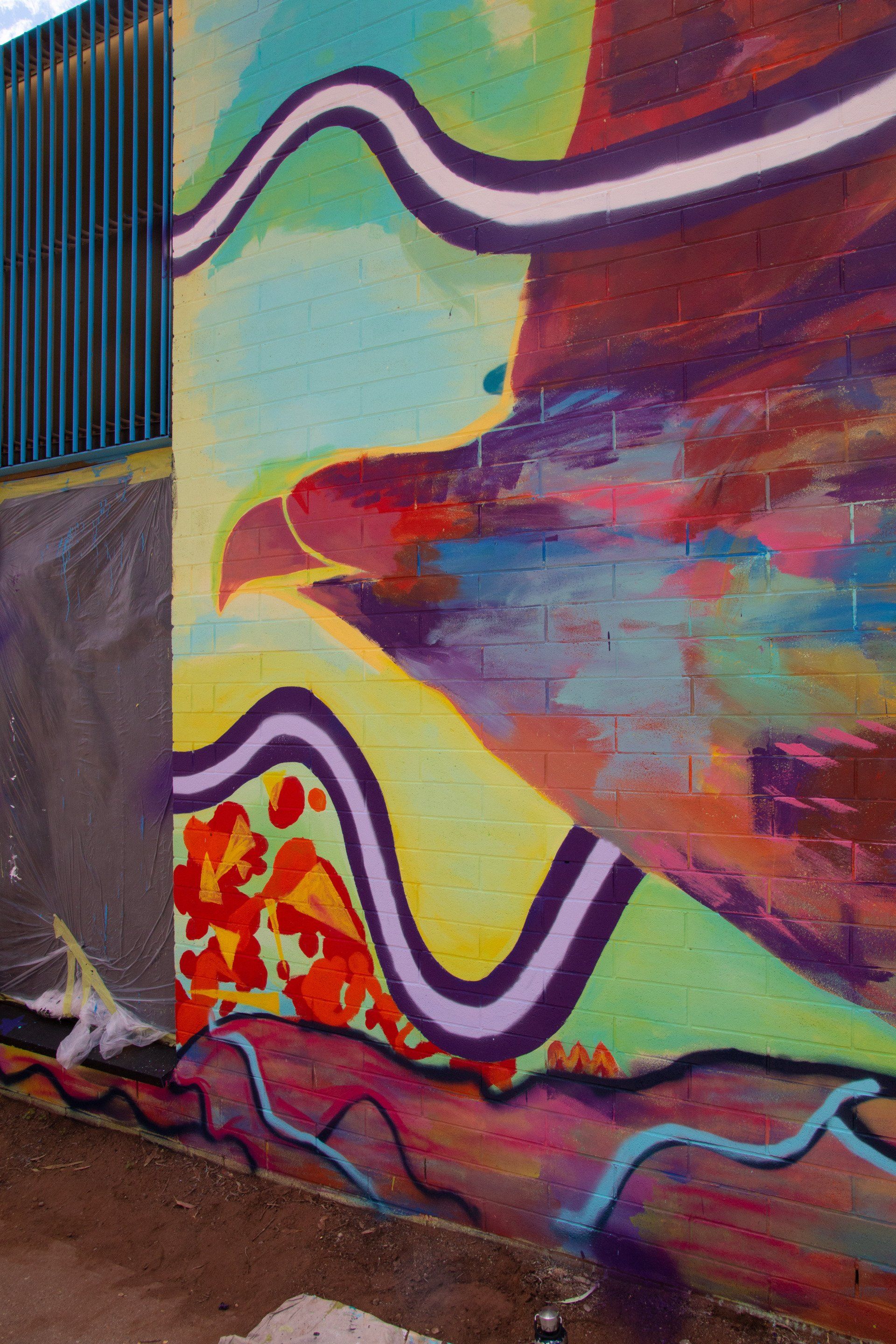 A wall with graffiti on it that looks like a painting