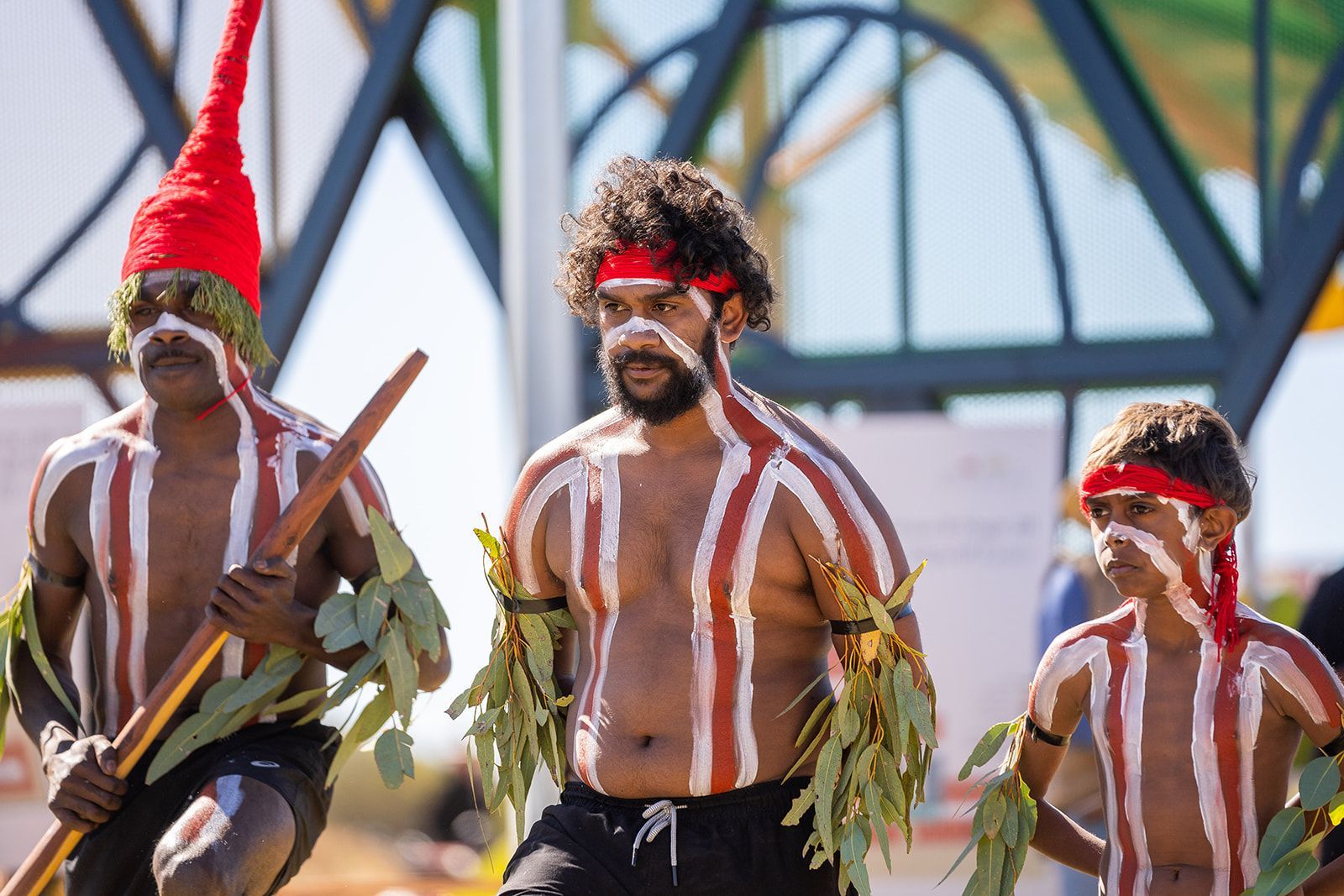 A group of men are dancing in a traditional costume.