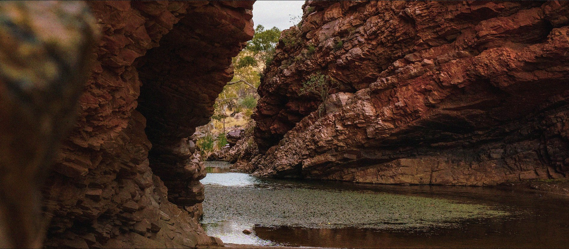 A river runs through a canyon between two rocks.