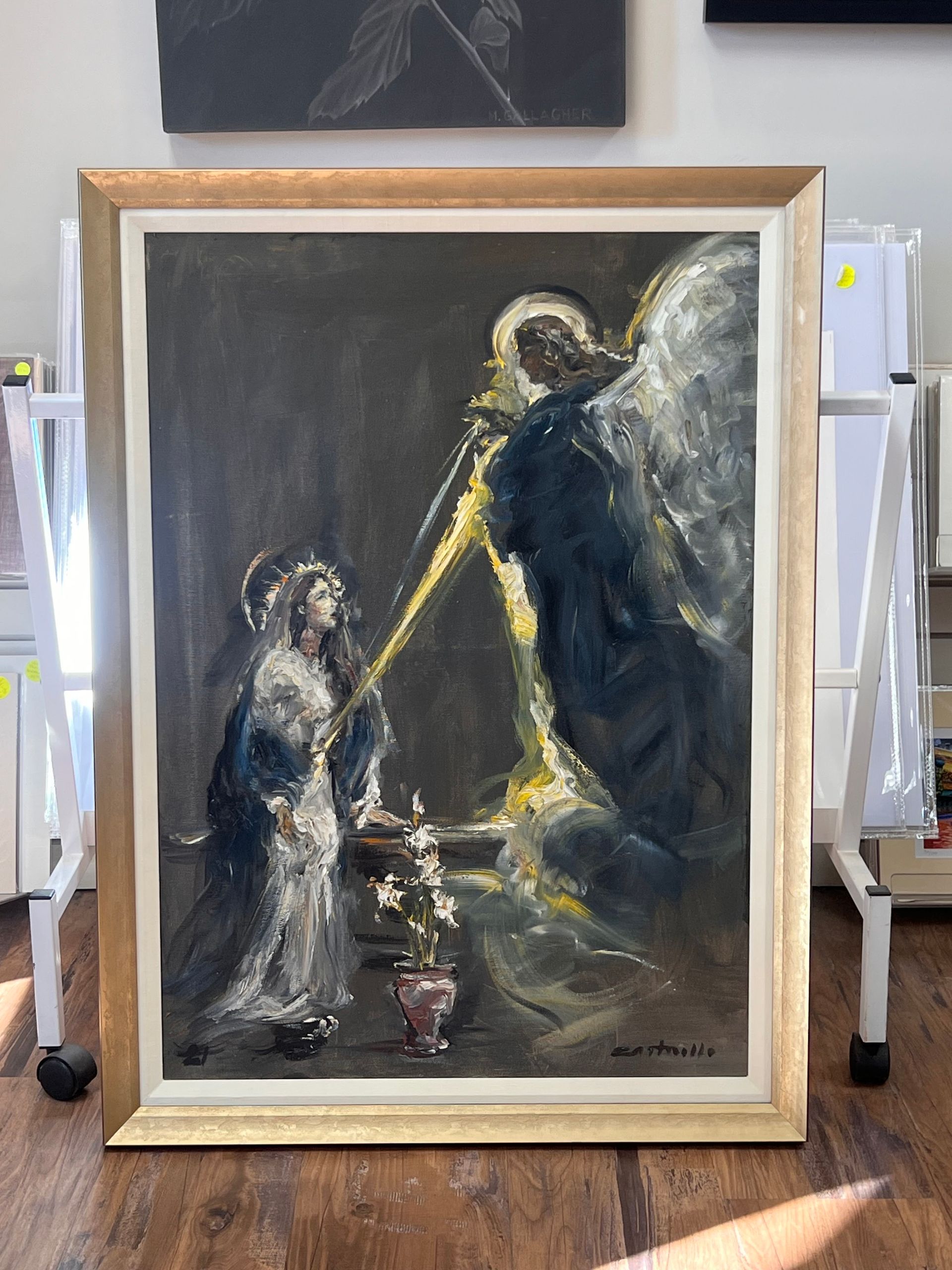 Painting of an angel with a beam of light, speaking to a woman in a dark room.